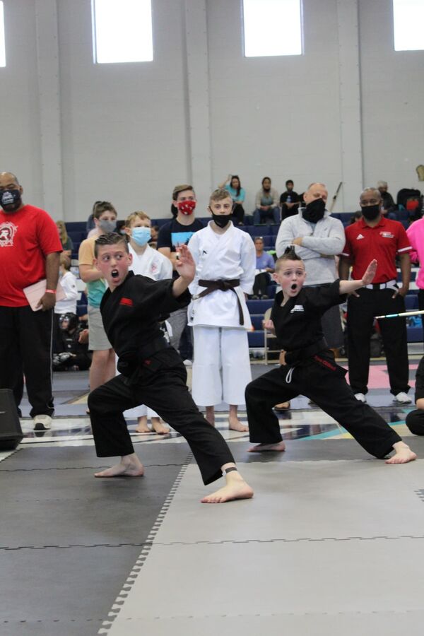 Karate competitor performing at a tournament